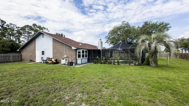 view of yard with a lanai