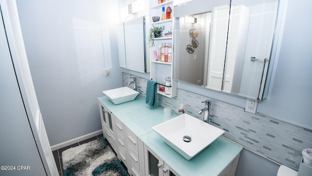 bathroom with decorative backsplash and vanity