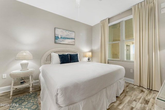 bedroom with light wood-type flooring