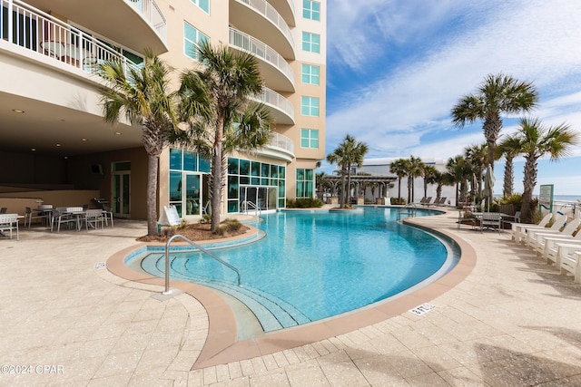 view of swimming pool featuring a patio area