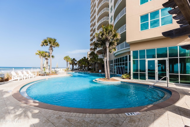 view of swimming pool with a patio