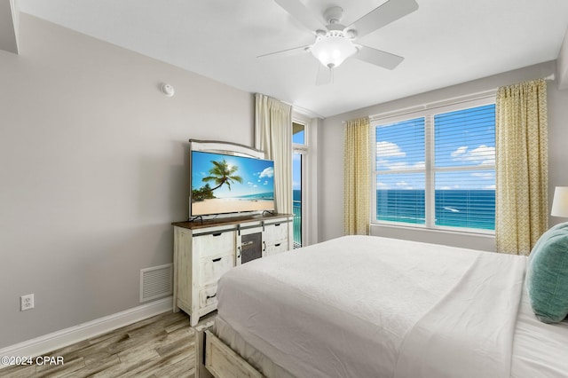 bedroom with hardwood / wood-style flooring and ceiling fan