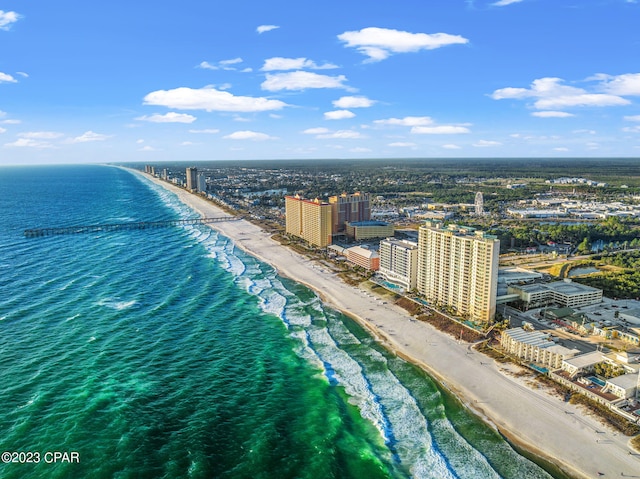 drone / aerial view featuring a view of the beach and a water view