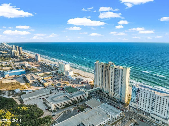 birds eye view of property featuring a view of the beach and a water view