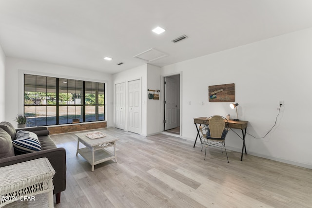 living room with light hardwood / wood-style flooring