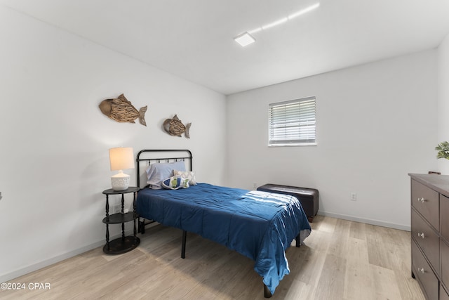 bedroom with light hardwood / wood-style flooring