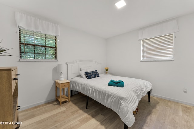 bedroom with light wood-type flooring