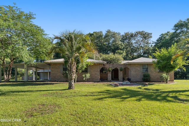 ranch-style house featuring a front lawn