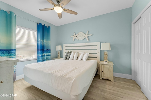 bedroom featuring a closet, ceiling fan, and light hardwood / wood-style floors