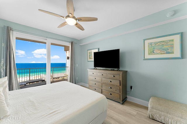 bedroom with access to outside, ceiling fan, and light wood-type flooring