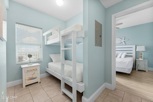 tiled bedroom featuring electric panel