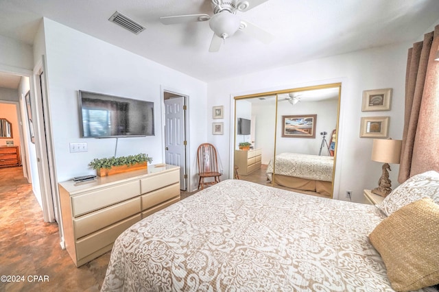 tiled bedroom featuring a closet and ceiling fan