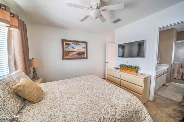 tiled bedroom featuring ceiling fan