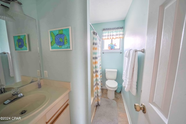 bathroom with vanity, tile patterned flooring, and toilet