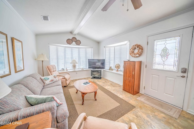 tiled living room with vaulted ceiling with beams, ceiling fan, and plenty of natural light