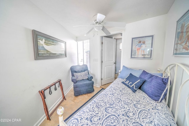 tiled bedroom with ceiling fan