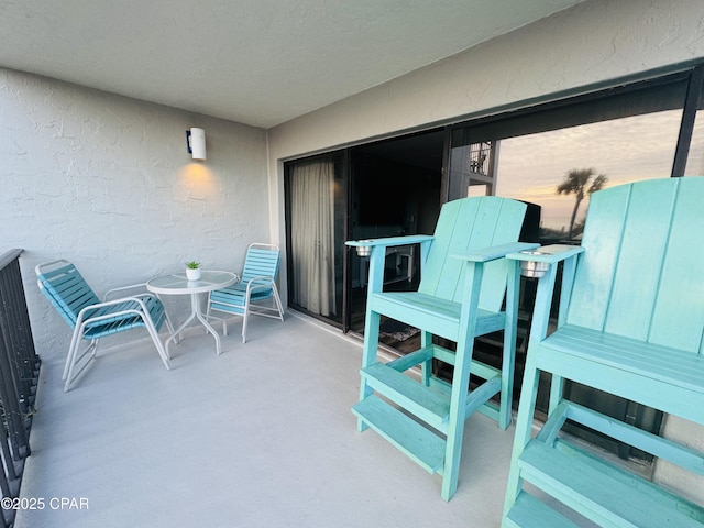 view of patio with a balcony