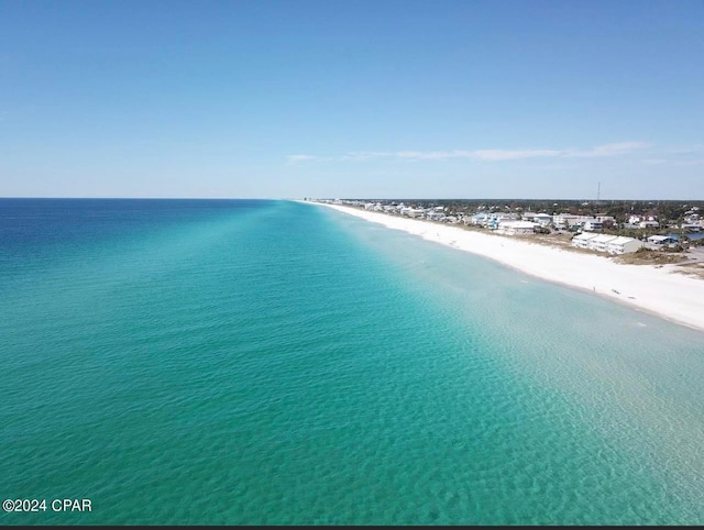 aerial view featuring a view of the beach and a water view