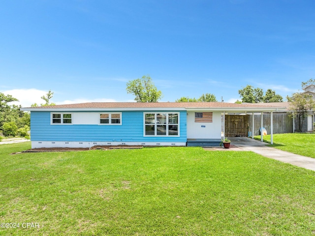 ranch-style home featuring an attached carport, crawl space, and a front yard