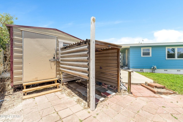 exterior space featuring an outdoor structure and a storage shed