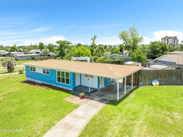 view of front of home with an attached carport, fence, driveway, crawl space, and a front lawn