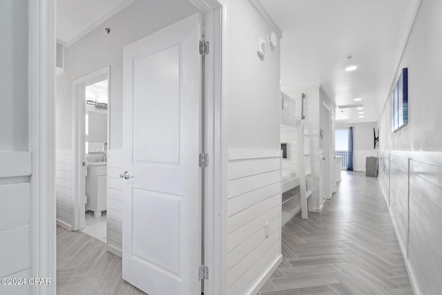 hallway featuring light parquet flooring