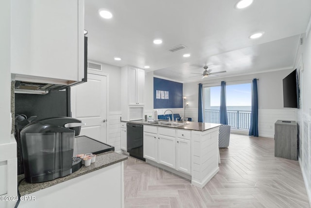 kitchen with ceiling fan, sink, white cabinetry, light parquet floors, and black dishwasher