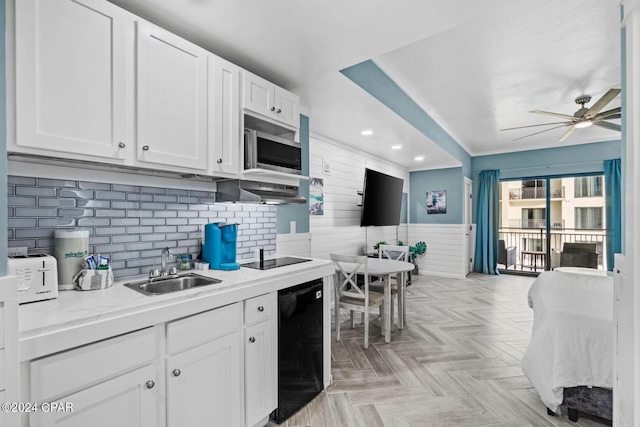 kitchen featuring sink, white cabinetry, black appliances, ceiling fan, and light parquet floors