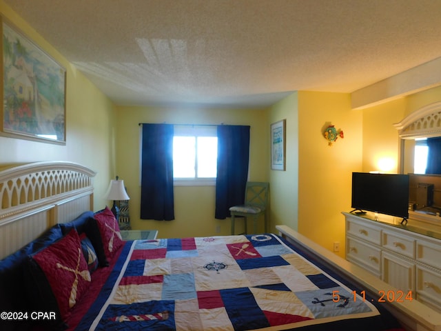 bedroom featuring a textured ceiling