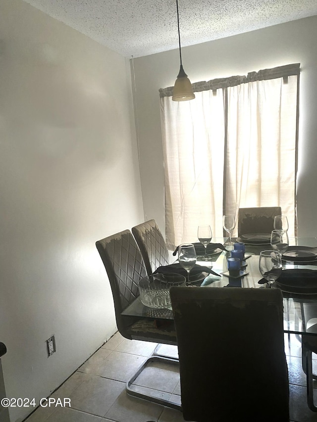 dining area featuring a textured ceiling