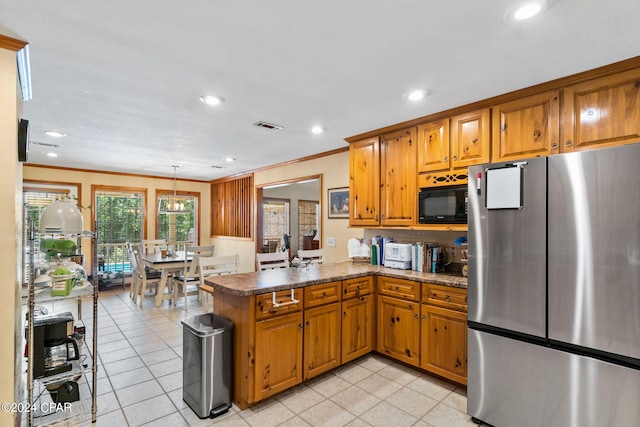 kitchen featuring kitchen peninsula, stainless steel fridge, ornamental molding, black microwave, and pendant lighting