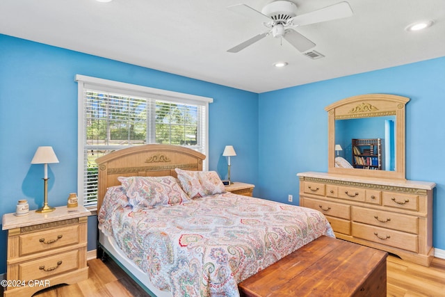 bedroom featuring light wood-type flooring and ceiling fan