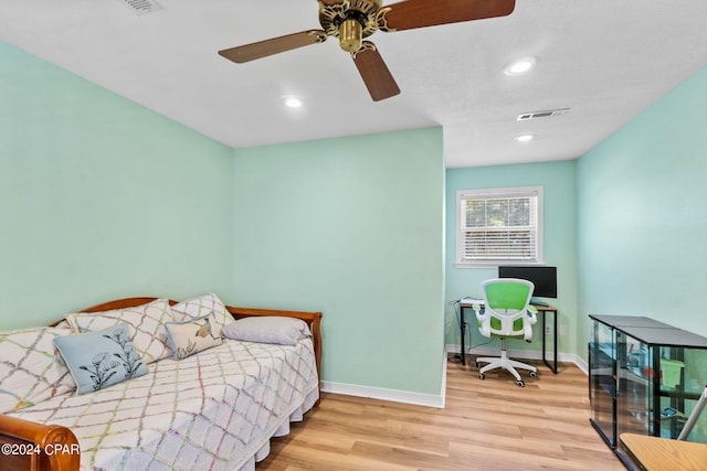 bedroom featuring light hardwood / wood-style flooring and ceiling fan