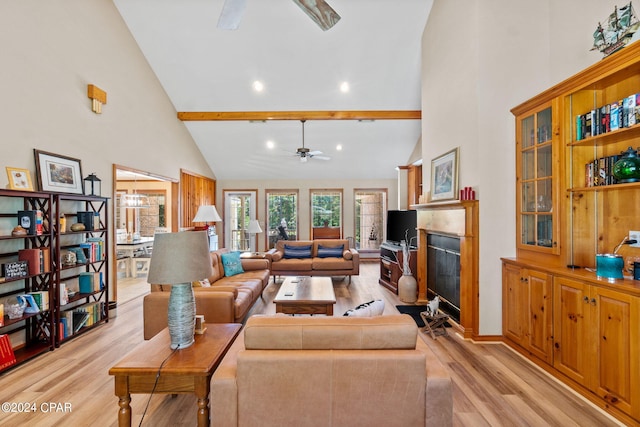 living room with ceiling fan, light hardwood / wood-style flooring, beamed ceiling, and high vaulted ceiling