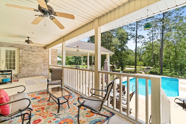 exterior space featuring ceiling fan