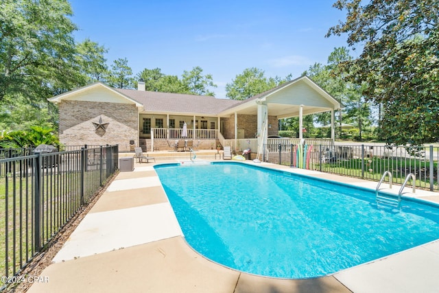 view of pool featuring a patio