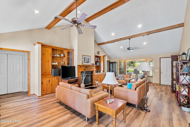 living room with beam ceiling, ceiling fan, high vaulted ceiling, and light hardwood / wood-style floors