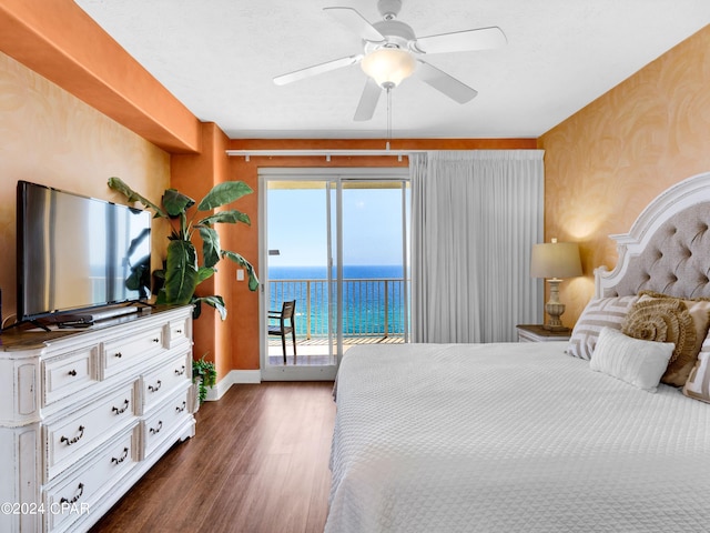 bedroom featuring access to exterior, ceiling fan, and dark hardwood / wood-style flooring