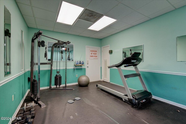 exercise area featuring a drop ceiling