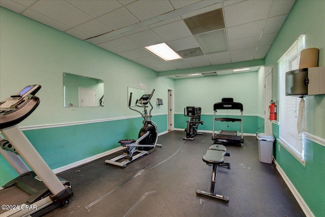 exercise area featuring a drop ceiling