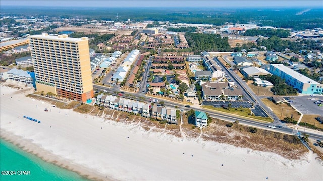 birds eye view of property featuring a water view and a view of the beach