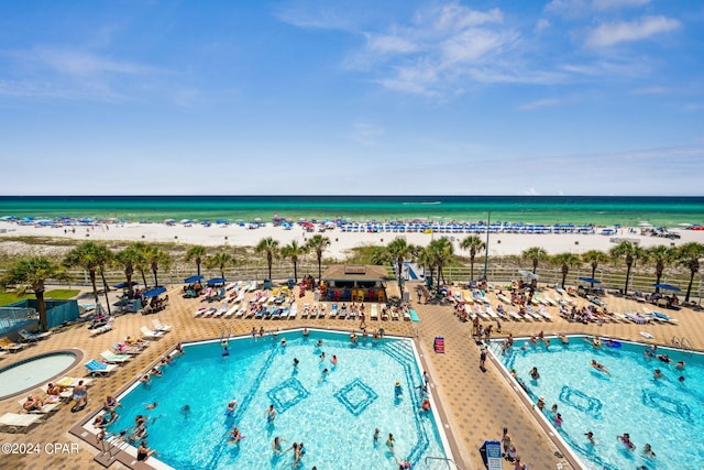 aerial view featuring a water view and a beach view