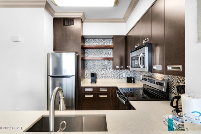 kitchen with backsplash, dark brown cabinetry, sink, and appliances with stainless steel finishes