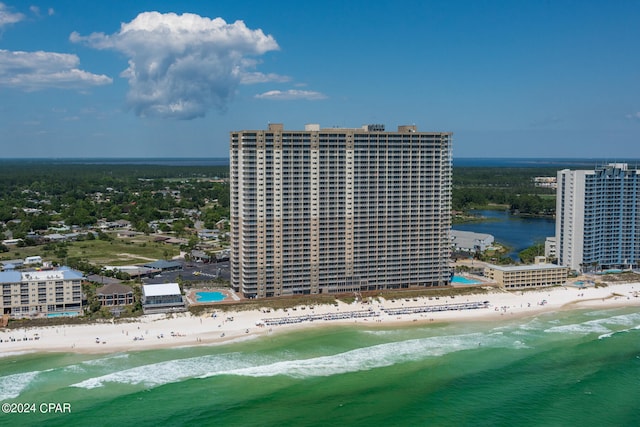 birds eye view of property featuring a view of the beach and a water view