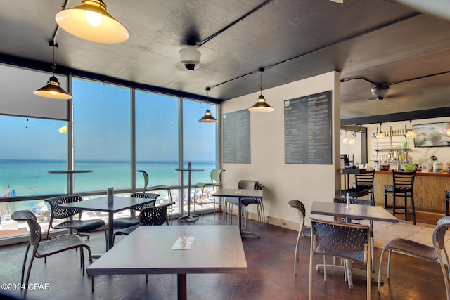 interior space with plenty of natural light and a water view