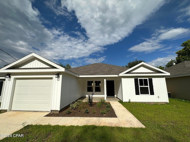 view of front facade with a front lawn and a garage