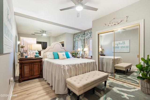 bedroom with ceiling fan, a closet, and light wood-type flooring