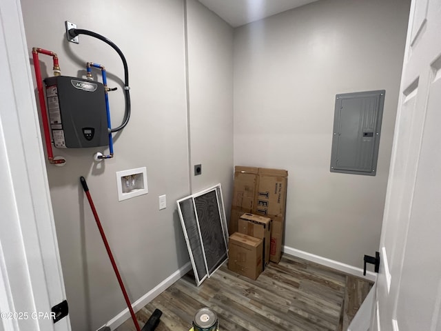 washroom with dark hardwood / wood-style floors, water heater, electric panel, hookup for a washing machine, and hookup for an electric dryer