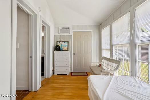 208 3rd St Unit 1/2, Panama City Beach, FL 32413 - bedroom with a wall mounted AC and lofted ceiling