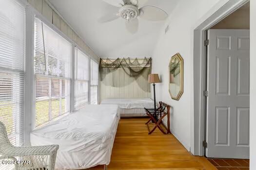 208 3rd St Unit 1/2, Panama City Beach, FL 32413 - bedroom with a ceiling fan and wood finished floors